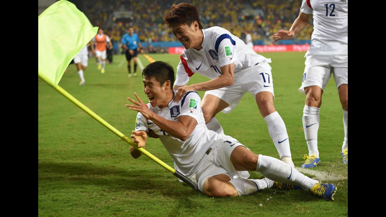 South Korean forward Lee Keun-Ho, left, celebrates with midfielder and captain Lee Chung-Yong after scoring the first goal of the game late in the second half.