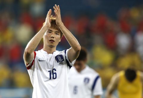 South Korean midfielder Ki Sung-Yueng applauds after his team's match against Russia during the World Cup on Tuesday, June 17, in Cuiaba, Brazil. The game ended 1-1.