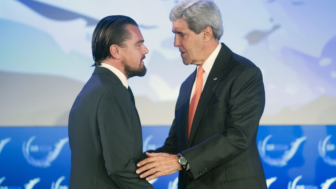 Secretary of State John Kerry talks with actor Leonardo DiCaprio after they both spoke at the second day of the State Department's 'Our Ocean' conference in Washington.