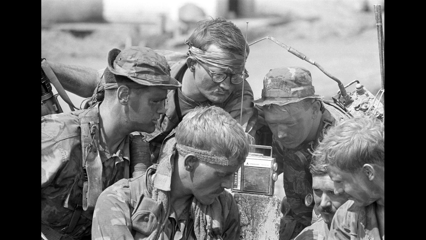 Oliver Noonan, a former photographer with the Boston Globe, captured this image of American soldiers listening to a radio broadcast in Vietnam in 1966. Noonan took leave from Boston to work in Vietnam for the Associated Press. He died when his helicopter was shot down near Da Nang in August 1969. 