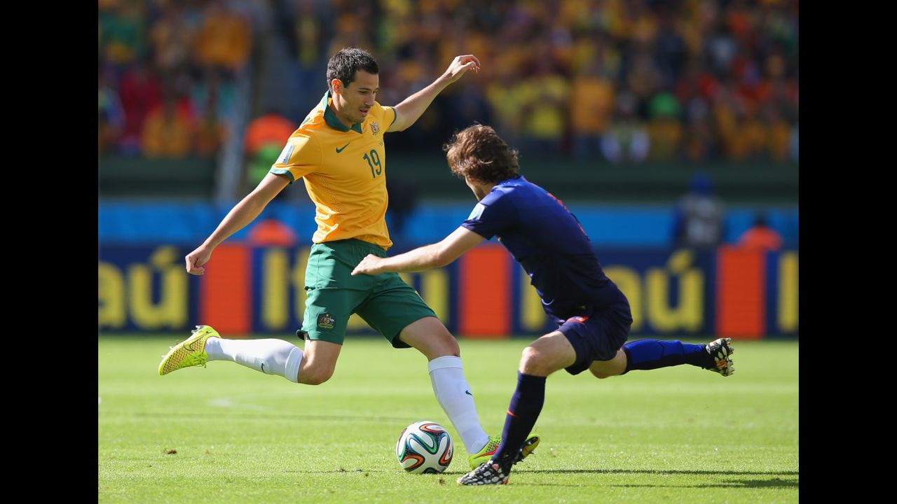 Ryan McGowan of Australia, left, takes on Daley Blind of the Netherlands. 