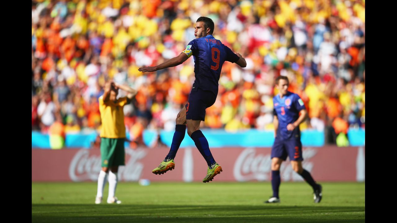 Van Persie celebrates after scoring his team's second goal and tying the game at 2-2. It was his third goal of the tournament.