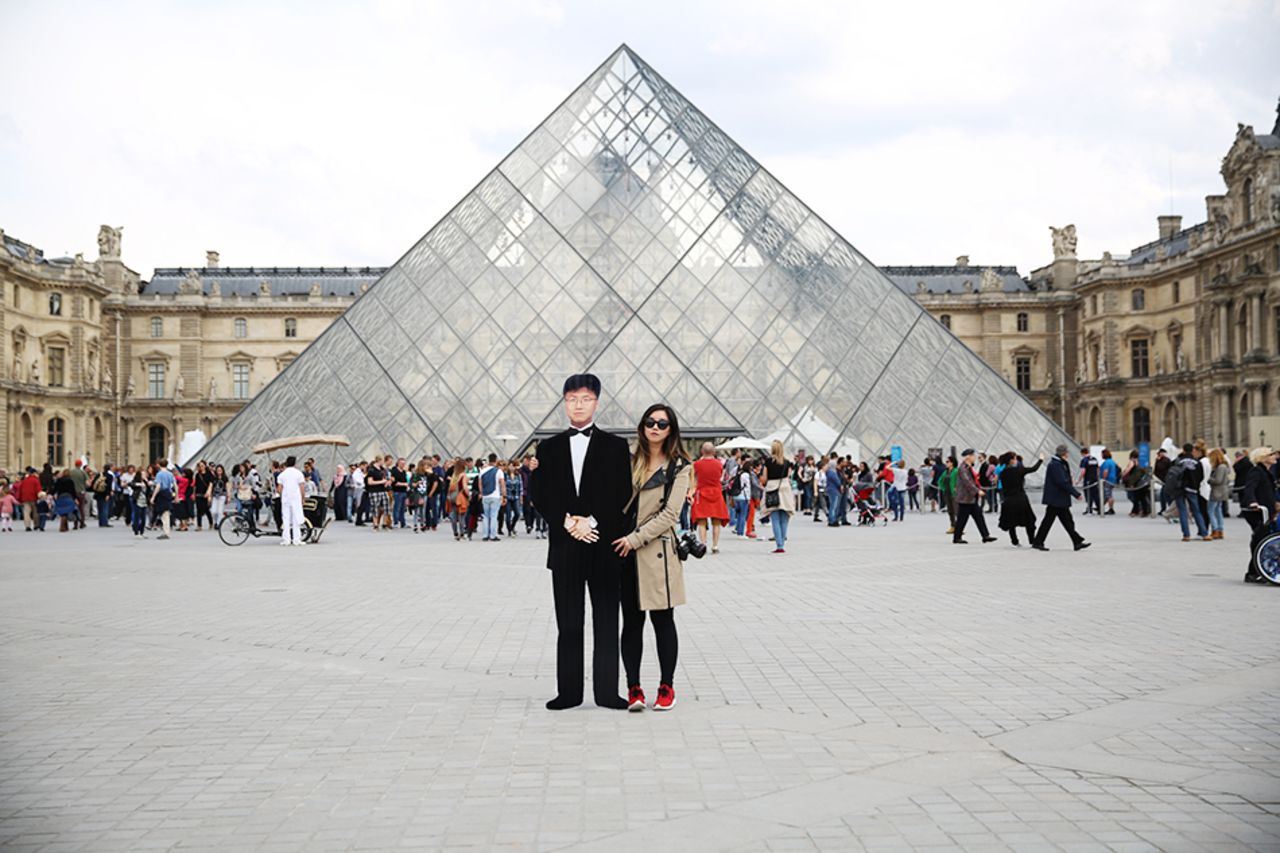 "I consider myself an artist, and when I set out on this mission I wanted to honor my father's memory and take beautiful photos," says Yang, who visited the Louvre (pictured) in Paris. 