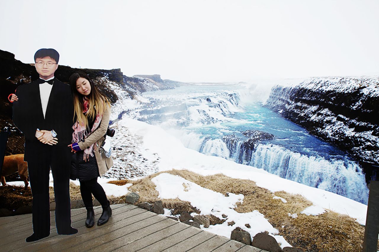 To cope with her grief after his death, New Yorker Jinna Yang took a life-sized cutout of her father on a trip he'd dreamed of making. The dad-daughter team posed for shots across Europe, including Gullfoss Waterfall in Iceland (pictured).