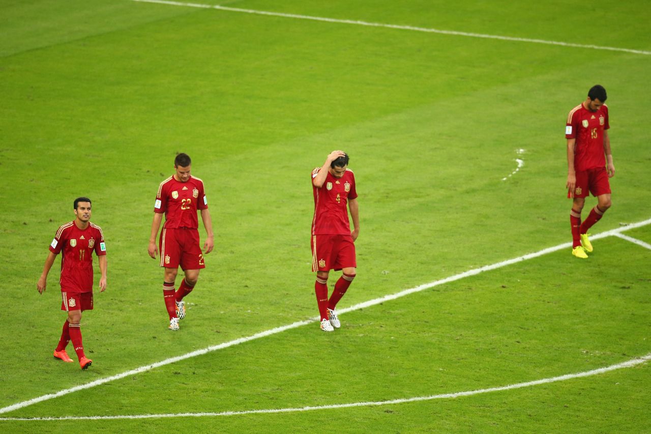 From left, Spanish players Pedro, Cesar Azpilicueta, Javi Martinez and Sergio Ramos react after Chile scored to take a 2-0 lead.
