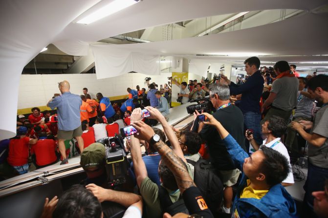 Security personnel attempt to control Chilean fans who <a href="index.php?page=&url=http%3A%2F%2Fbleacherreport.com%2Farticles%2F2101732-chile-fans-break-into-maracana-press-room-before-world-cup-match-vs-spain" target="_blank" target="_blank">invaded the press room</a> at the Maracana Stadium before the match.