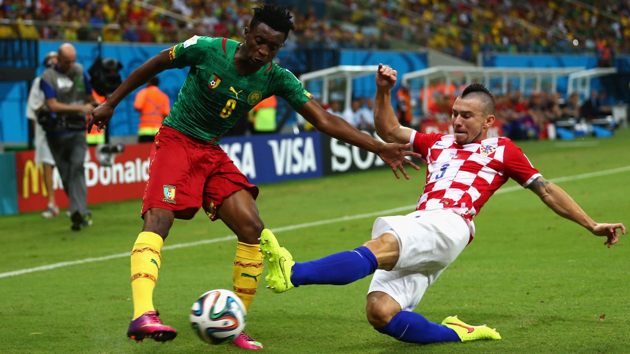 Benjamin Moukandjo of Cameroon is tackled by Danijel Pranjic of Croatia.