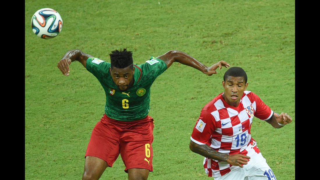Cameroon's Alexandre Song vies for the ball with Croatia's Sammir.
