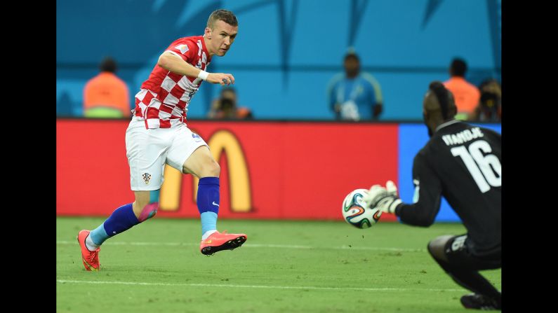 Croatian midfielder Ivan Perisic shoots past Itandje.