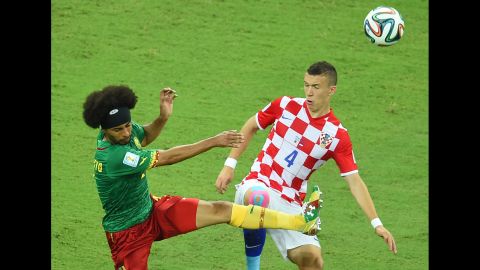 Cameroon's Benoit Assou-Ekotto challenges Croatia's Ivan Perisic.