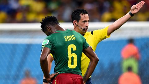 Alexandre Song of Cameroon is sent off by referee Pedro Proenca.