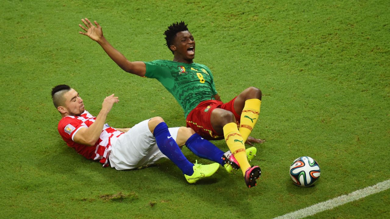 Danijel Pranjic of Croatia tackles Cameroon's Benjamin Moukandjo.