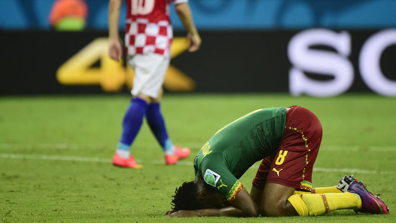 Cameroon's Benjamin Moukandjo, right, reacts during a World Cup match against Croatia in Manaus, Brazil.
