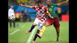 Cameroon's Eric Maxim Choupo-Moting, right tackles Croatia's Darijo Srna during a World Cup match in Manaus, Brazil, on Wednesday, June 18.