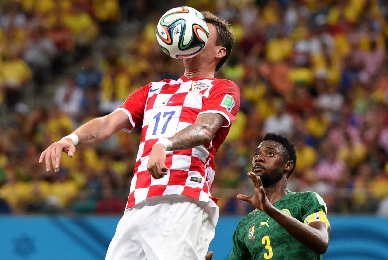 Croatia's Mario Mandzukic controls the ball in front of Cameroon's Nicolas Nkoulou.