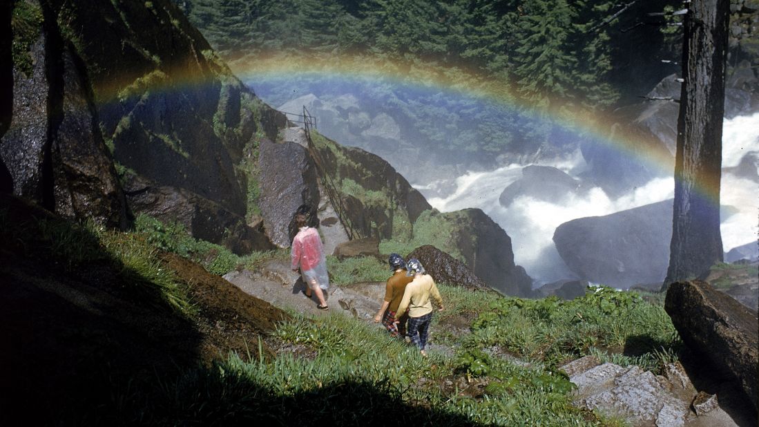 Hikers walk past a rainbow caused by mist from Vernal Falls, circa 1962. There are <a href="http://www.nps.gov/yose/planyourvisit/hiking.htm" target="_blank" target="_blank">800 miles of trails</a> at the park. 
