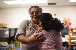 Volunteer Maria Eugenia Carrasco says goodbye to a Guatemalan mother headed across the country.