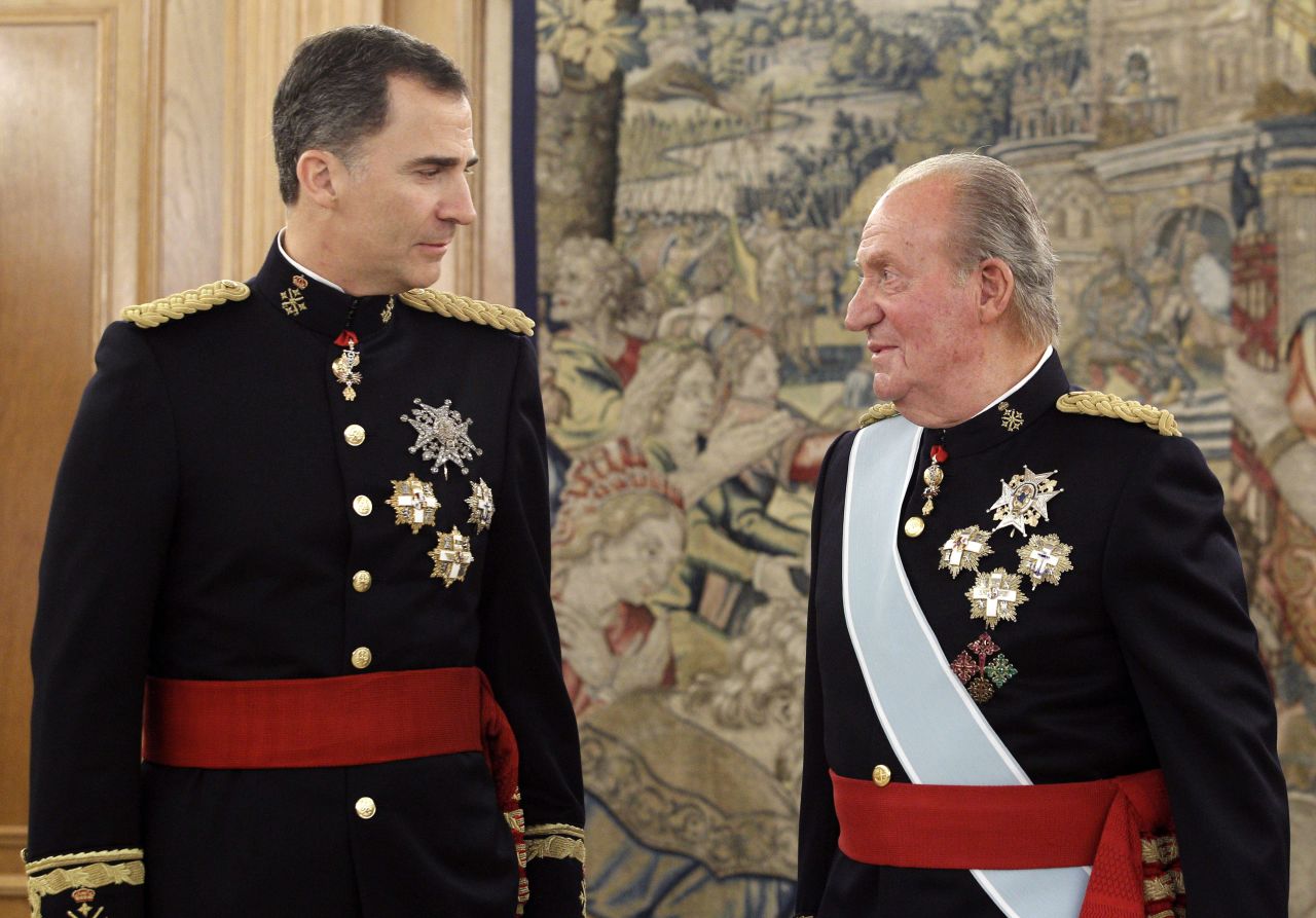 Spain's King Felipe VI, left, promises a monarchy for "new times" following the abdication of his father, Juan Carlos. Here, father and son attend a ceremony Thursday, June 19, in Madrid before the new king's official coronation. Click through to see other European royal heirs: