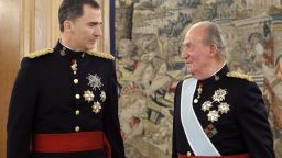 King Felipe VI of Spain, left, took up his father King Juan Carlos' title on June 19. Above, the father and son are attend a ceremony on the day of the new king's coronation.