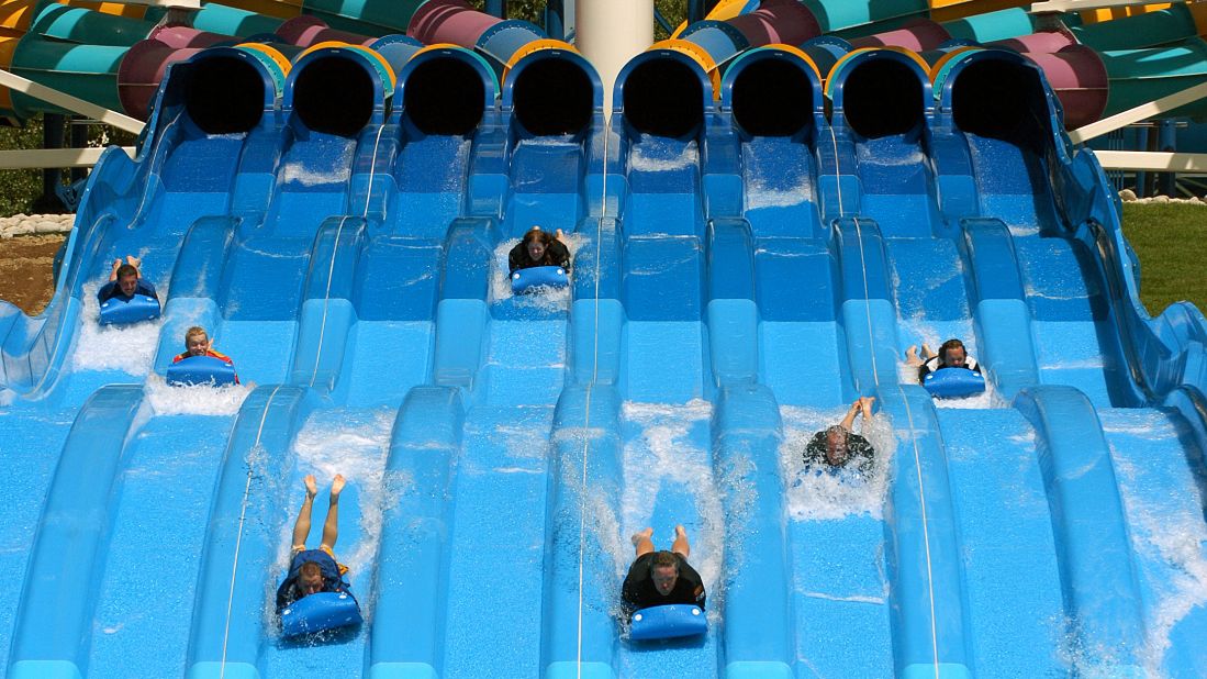 On Hyland Hills Water World's Turbo Racer (shown here) in Denver, Colorado, riders start headfirst, belly-down on a thin mat, dashing down an eight-lane, racetrack slide. The park was the ninth most visited water park in 2013.