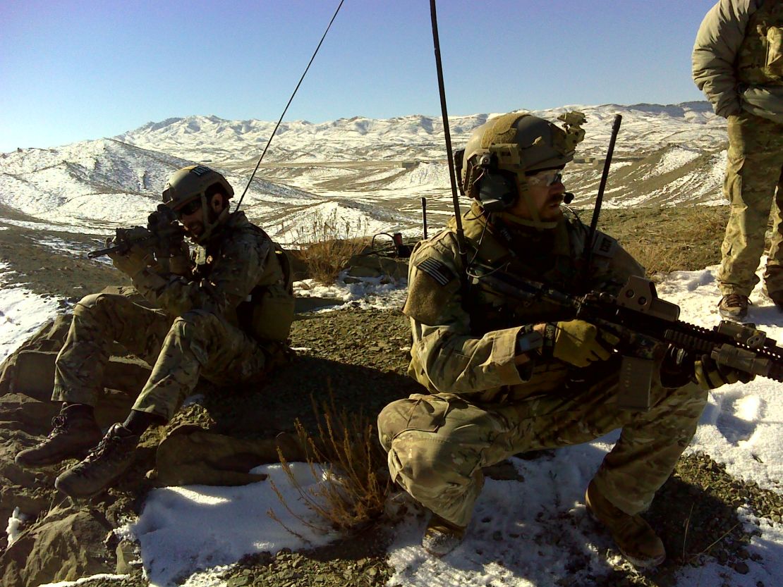 Maj. Charlie Hodges, right, an Air Force special tactics officer, stands watch during a combat mission in Afghanistan.