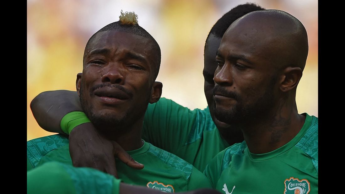 Serey Die cries during the national anthem before the match.