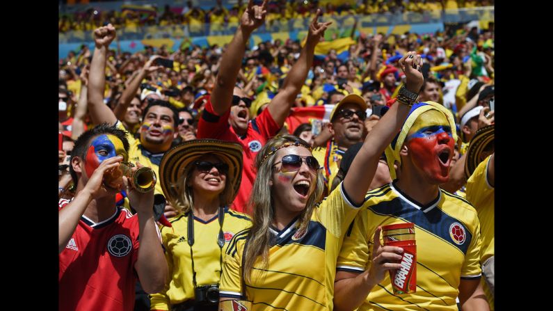 Colombia fans cheer before the start of the match.