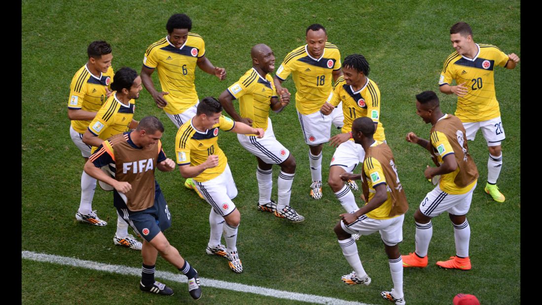 Colombia players dance after the first goal of the game, which was scored by James Rodriguez (No. 10) on a header.