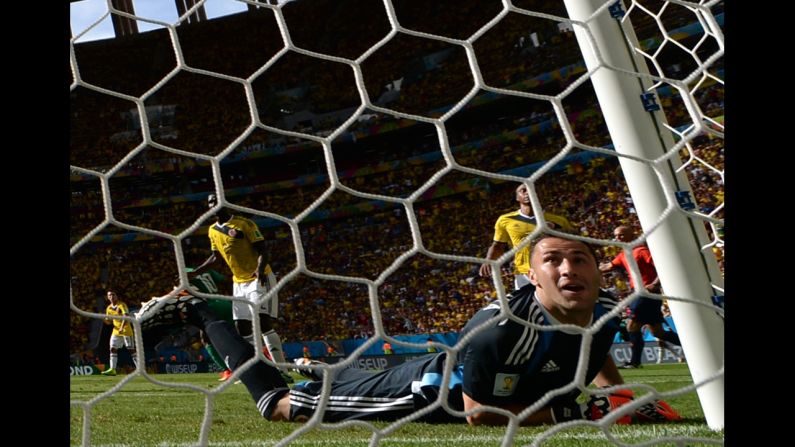 Colombian goalkeeper David Ospina fails to stop a second-half shot by Ivory Coast forward Gervinho during a World Cup match Thursday, June 19, in Brasilia, Brazil. Colombia won the match 2-1.