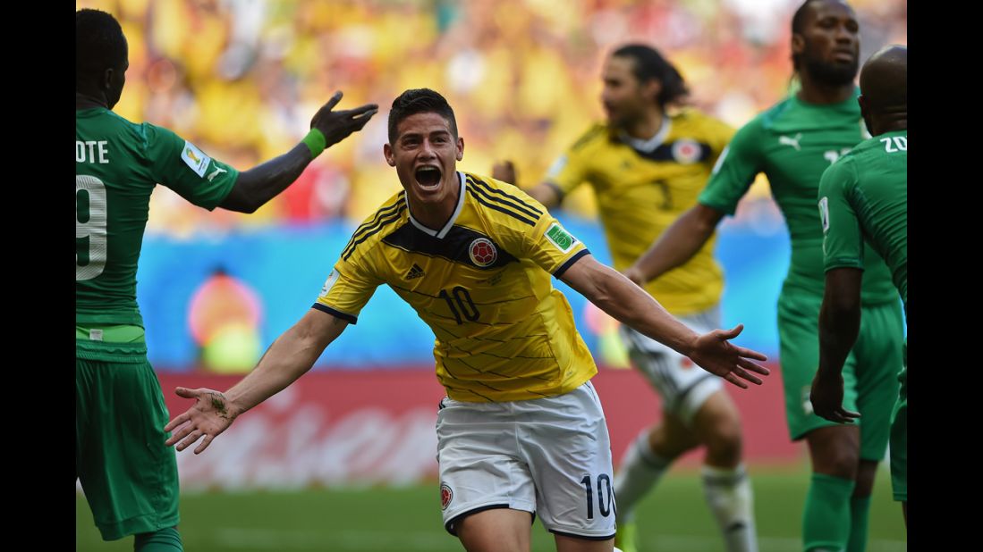Colombian midfielder James Rodriguez celebrates after he headed in a corner kick for the first goal of the game.