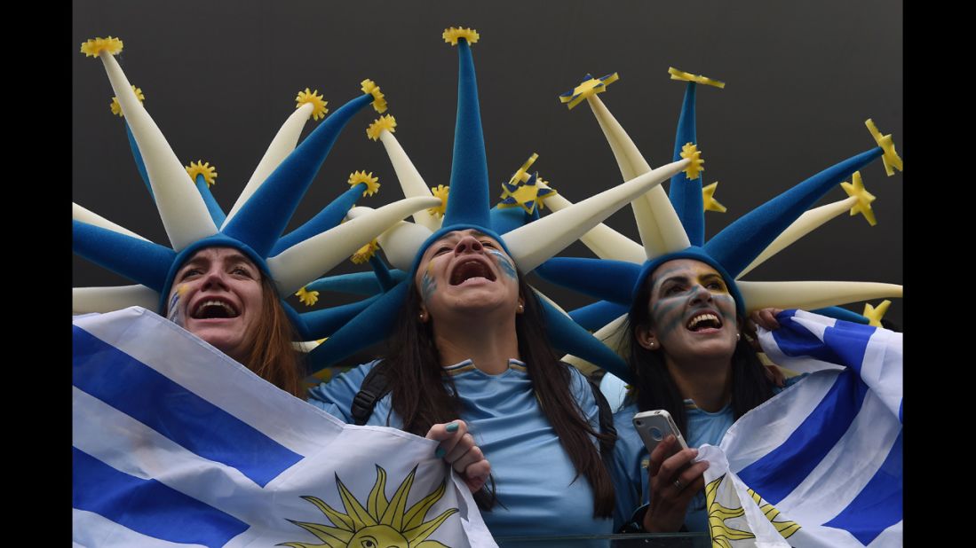 Uruguay fans cheer before the start of the match.