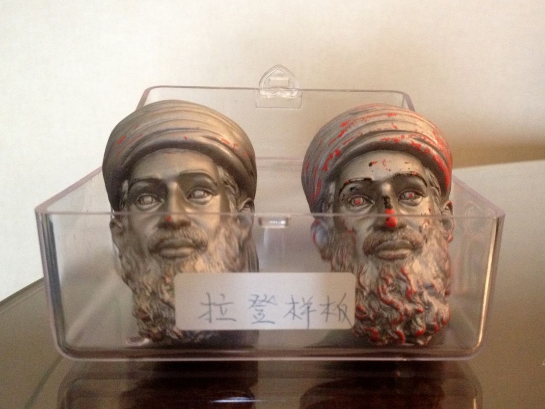 Seen here are two sample heads of the Osama bin Laden action figure doll.