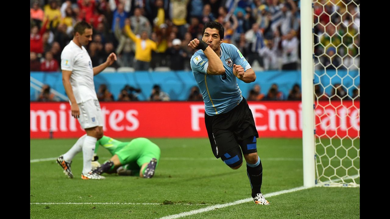 Suarez celebrates after steering a header past English goalkeeper Joe Hart in the first half.