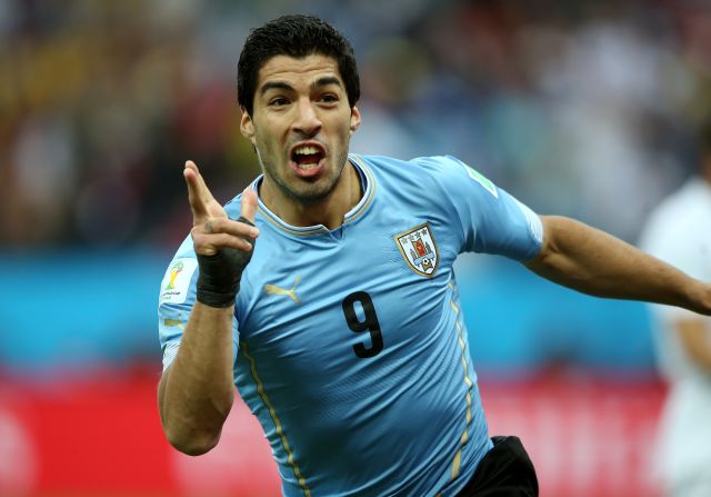 Suarez was banned for nine international matches. Here, Suarez celebrates after scoring his team's first goal during the Group D victory over England in Sao Paulo, Brazil at the 2014 World Cup.