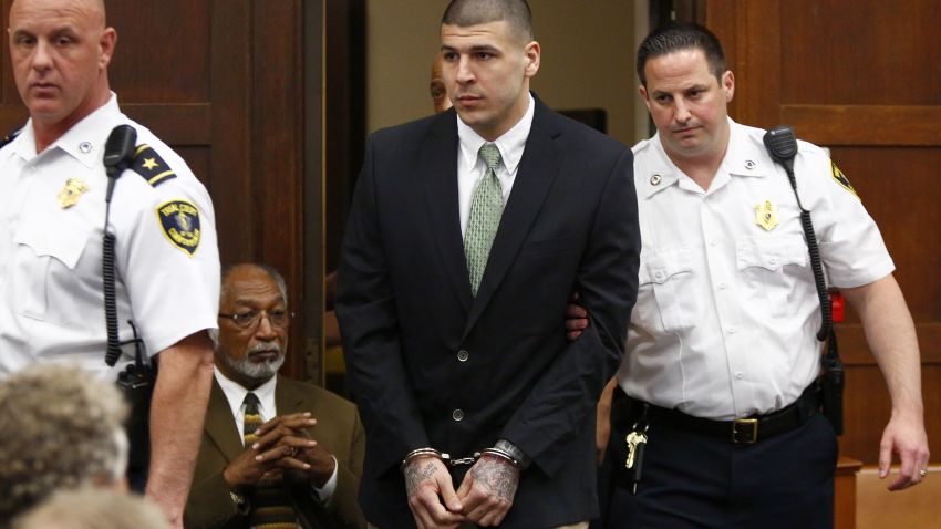 Former New England Patriots tight end Aaron Hernandez is led into the courtroom to be arraigned on homicide charges on Wednesday, May 28, in Boston. Hernandez pleaded not guilty in the 2012 murders of Daniel de Abreu and Safiro Furtado. He has also been charged in the 2013 murder of semipro football player Odin Lloyd.