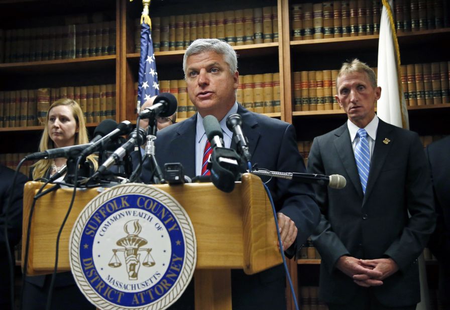 At a news conference in May 2014, Suffolk County District Attorney Dan Conley announces that Hernandez has been indicted for the July 2012 killings of Daniel de Abreu and Safiro Furtado.
