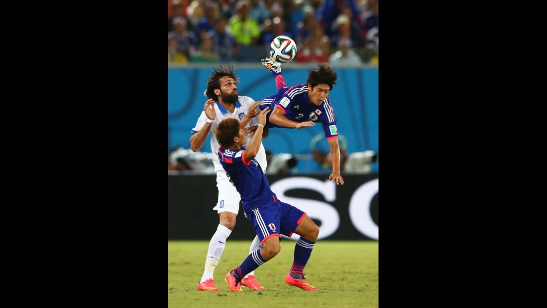 Uchida, right, is parallel with the ground after a collision with Samaras.