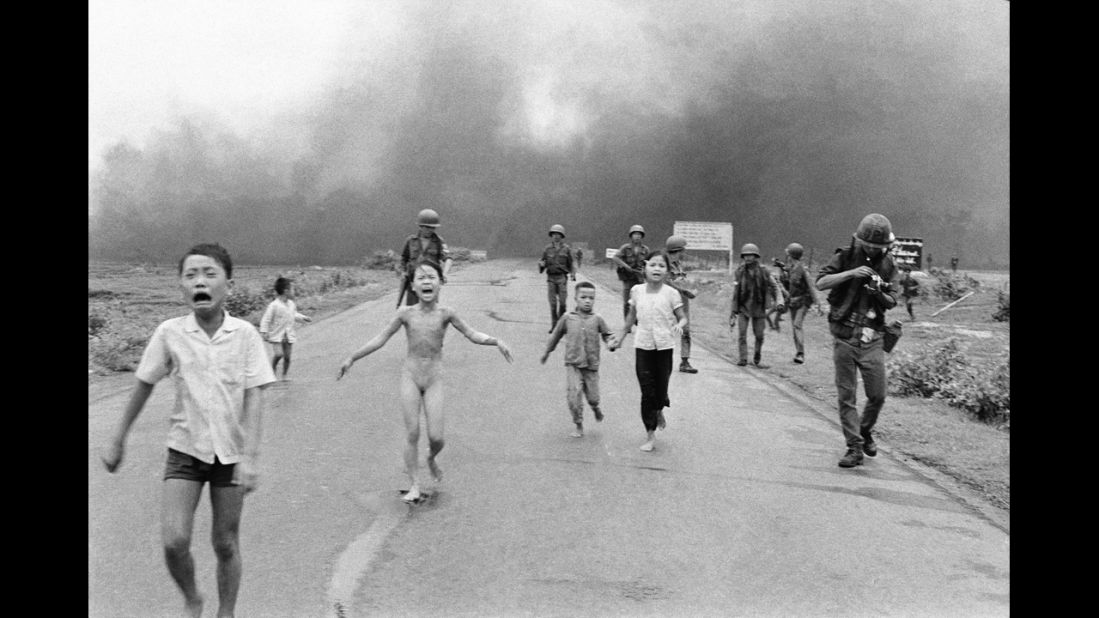 Associated Press photographer Nick Ut photographed terrified children running from the site of a Vietnam napalm attack in 1972. A South Vietnamese plane accidentally dropped napalm on its own troops and civilians. Nine-year-old Kim Phuc, center, ripped off her burning clothes while she ran. The image communicated the horrors of the war and contributed to growing U.S. anti-war sentiment. After taking the photograph, Ut took the children to a Saigon hospital.