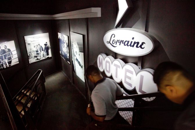 Museum workers pass through an exhibit depicting King's 1968 assassination. He was shot and killed while standing on the balcony of the Lorraine Motel in Memphis.