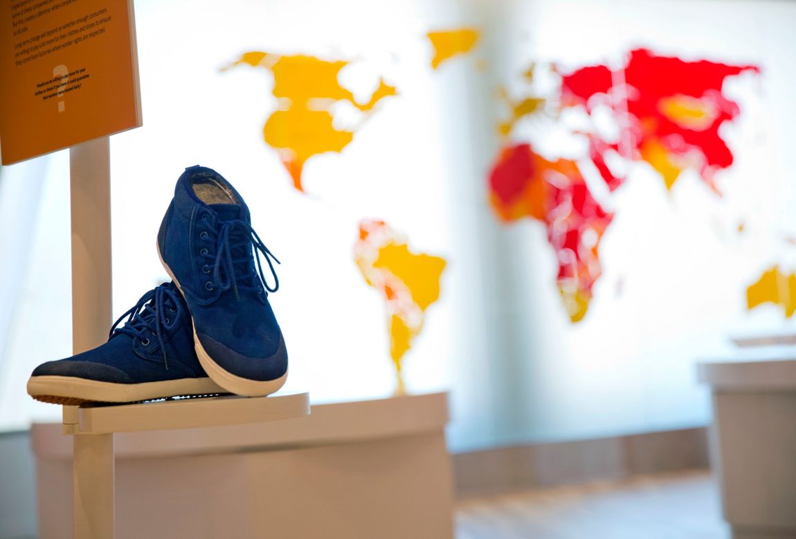 A pair of sneakers are displayed as part of an exhibit exploring the ethical footprint of common consumer products. The museum explores human rights struggles beyond the civil rights movement.