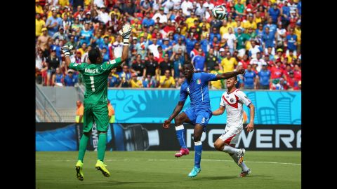 Balotelli, center, shoots wide past Costa Rican goalkeeper Keylor Navas.