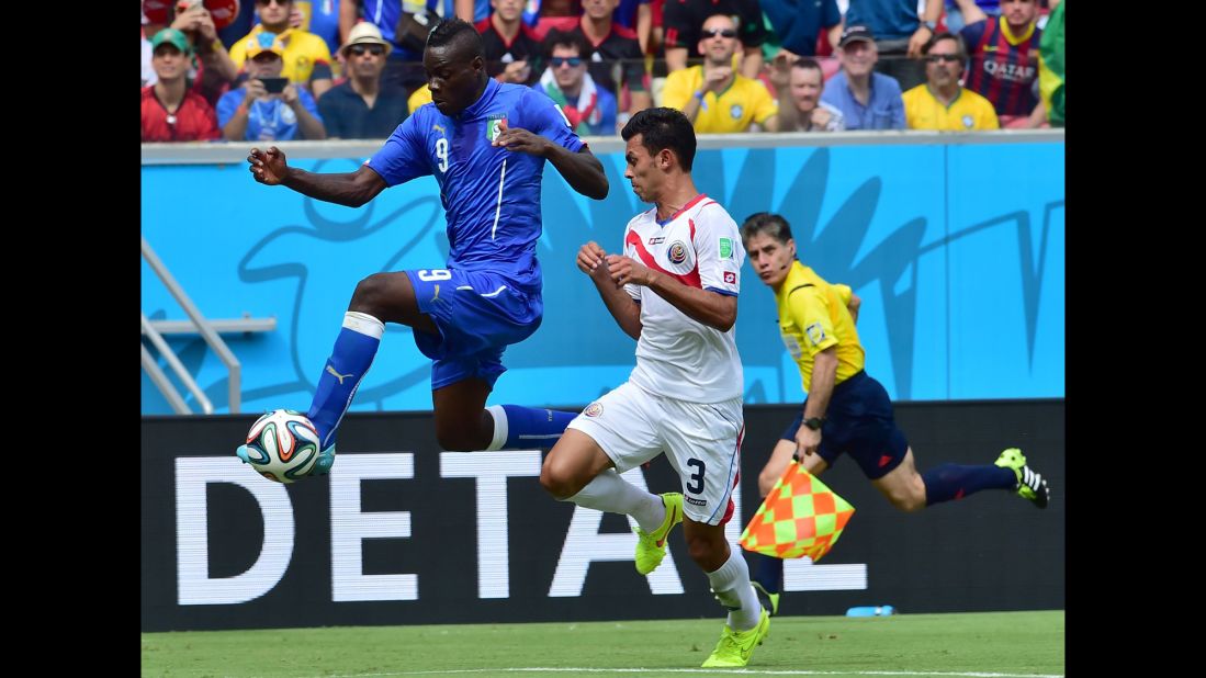 Balotelli traps the ball as he is chased by Gonzalez.