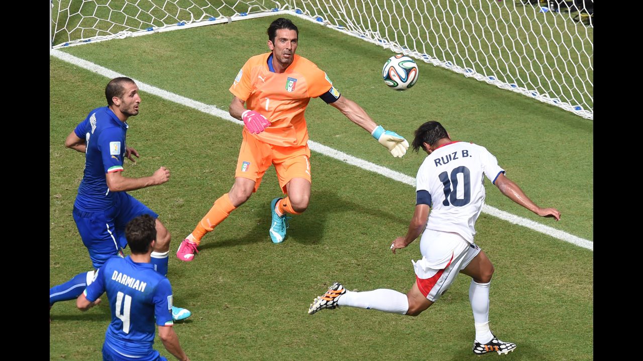 Costa Rican forward Bryan Ruiz heads the ball past Italian goalkeeper Gianluigi Buffon during the first half of a World Cup match Friday, June 20, in Recife, Brazil. Costa Rica held on to win 1-0 and clinch a spot in the next round of the tournament.