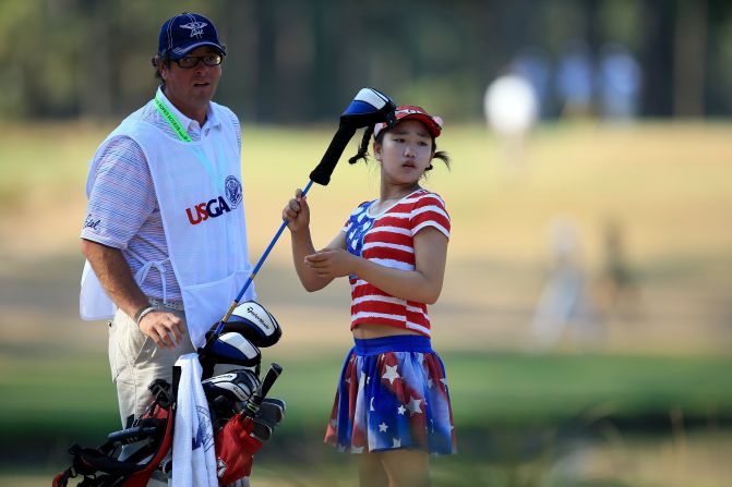 The 11-year-old suffered setbacks with two double-bogeys and a triple-bogey, but looked assured.