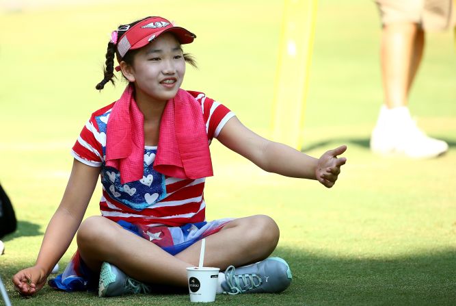 World No. 1 Stacy Lewis questioned the wisdom of allowing an 11-year-old to play in the high-pressure tournament, but Li responded with a relaxed round that included two birdies. 
