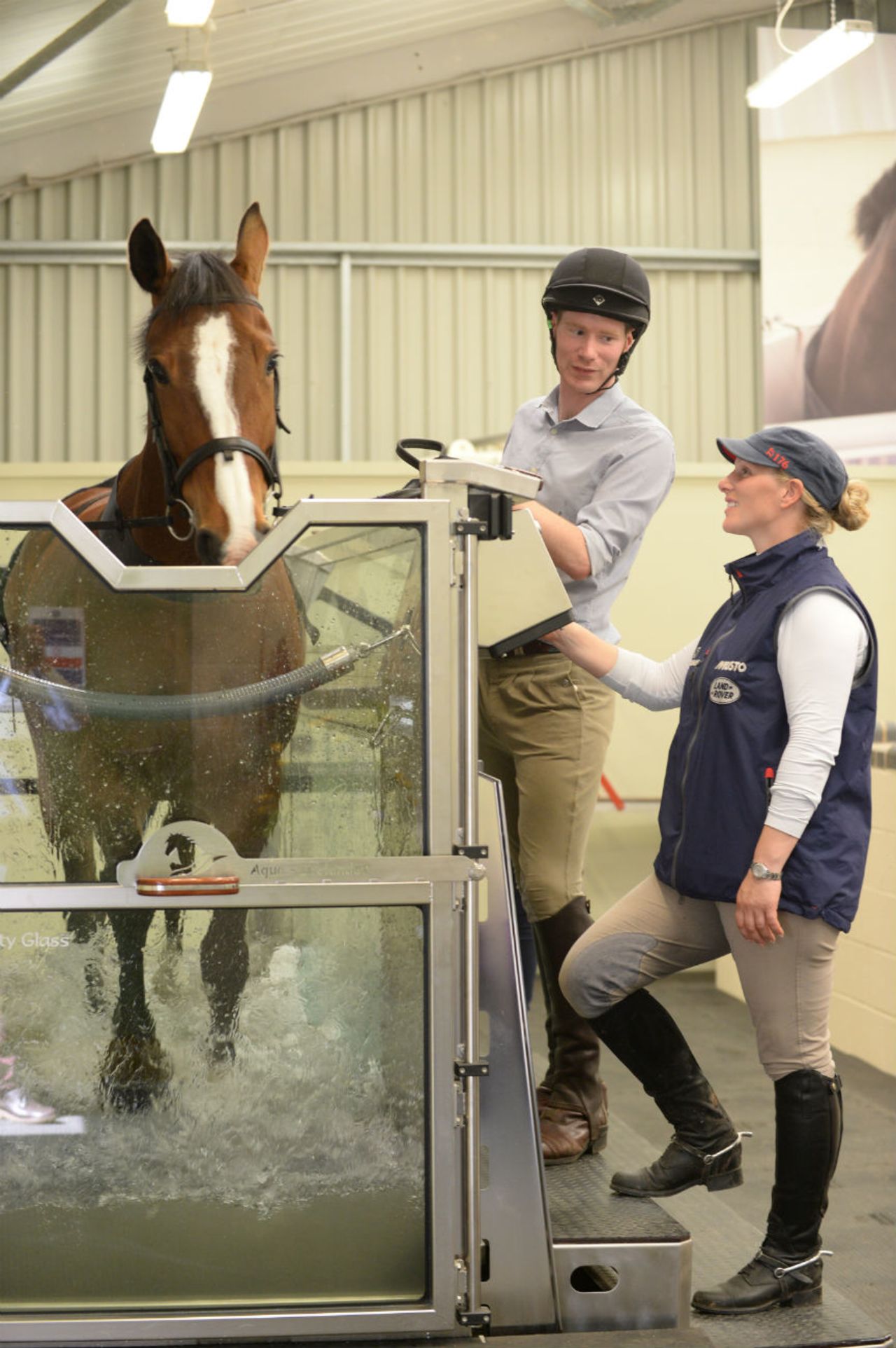 Zara Phillips, a member of British royalty preparing to compete at this year's World Equestrian Games, inspects an equine treadmill at Warwickshire College in the UK.