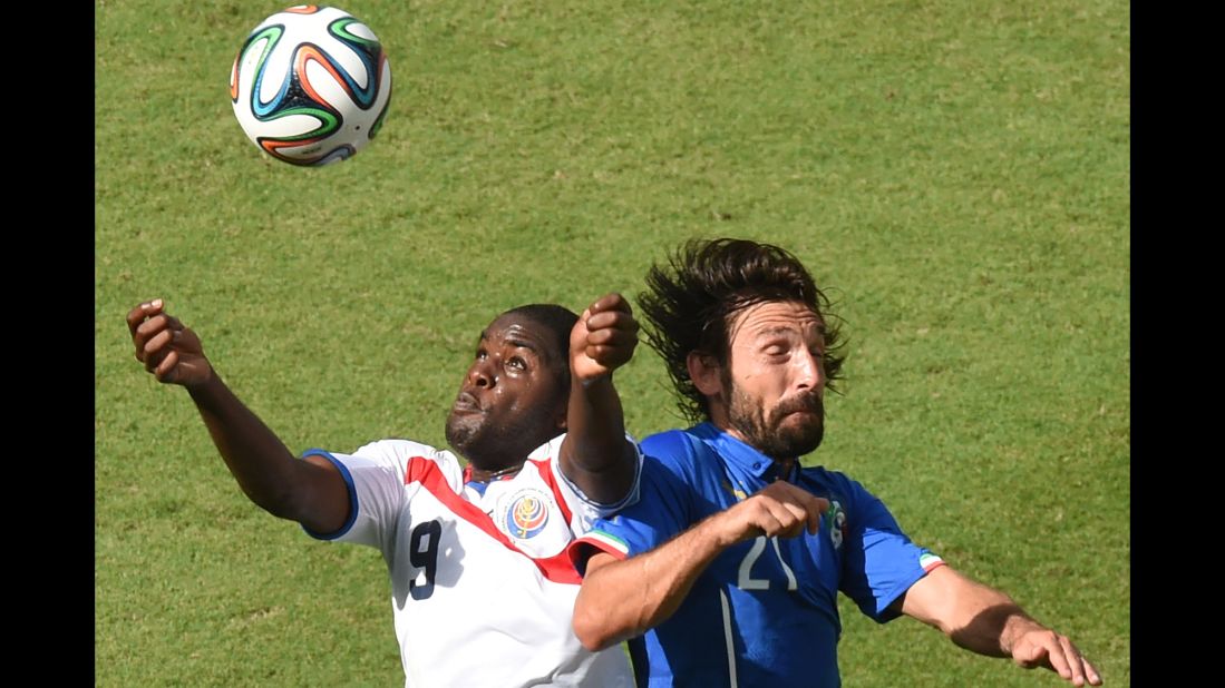 Costa Rica forward Joel Campbell, left, and Italy midfielder Andrea Pirlo vie for the ball.