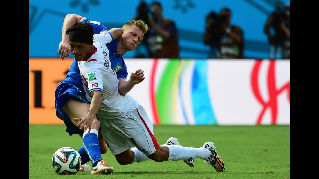 Italy defender Ignazio Abate, left, challenges Costa Rica midfielder Cristian Bolanos.