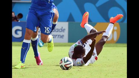 Campbell, right, falls after a tackle by Italian defender Giorgio Chiellini.