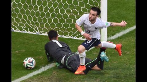France's Mathieu Valbuena runs past Benaglio after giving his team a 3-0 lead in the first half.